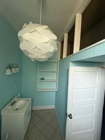 a bathroom with a sink and mirror