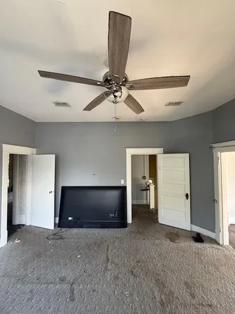 a living room with a bed and furniture