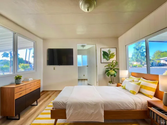 a bedroom with a bed and window