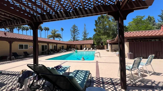 a view of a swimming pool with a patio