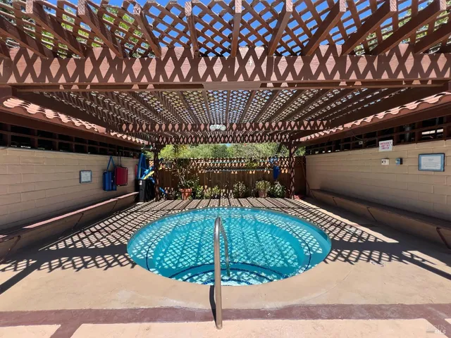 a room with pool table and windows