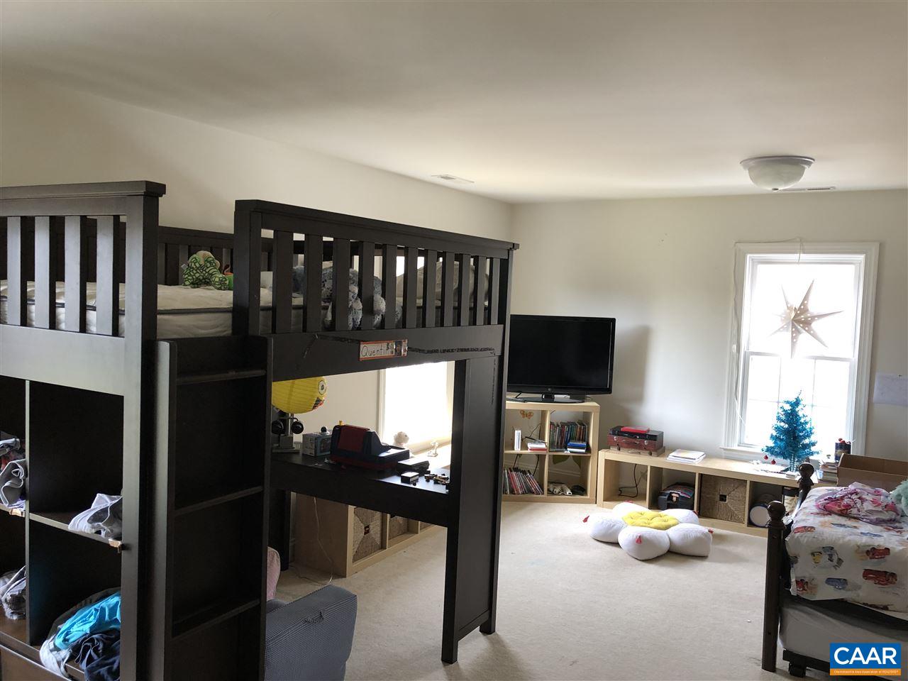 3285 Hardware River Road Charlottesville, VA 22903 - Photo 14 of 22 a living room with furniture a flat screen tv and a window