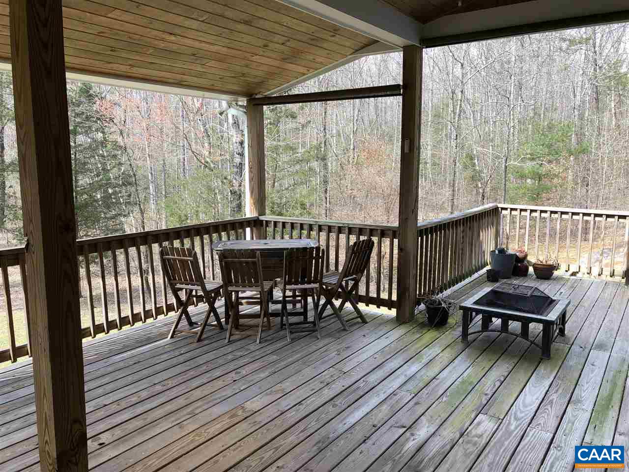 3285 Hardware River Road Charlottesville, VA 22903 - Photo 17 of 22 a view of a chairs and table on the wooden deck