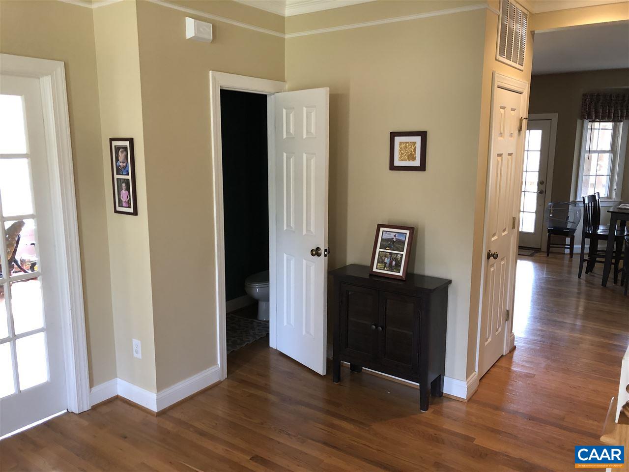 3285 Hardware River Road Charlottesville, VA 22903 - Photo 5 of 22 a view of a hallway with wooden floor and a living room