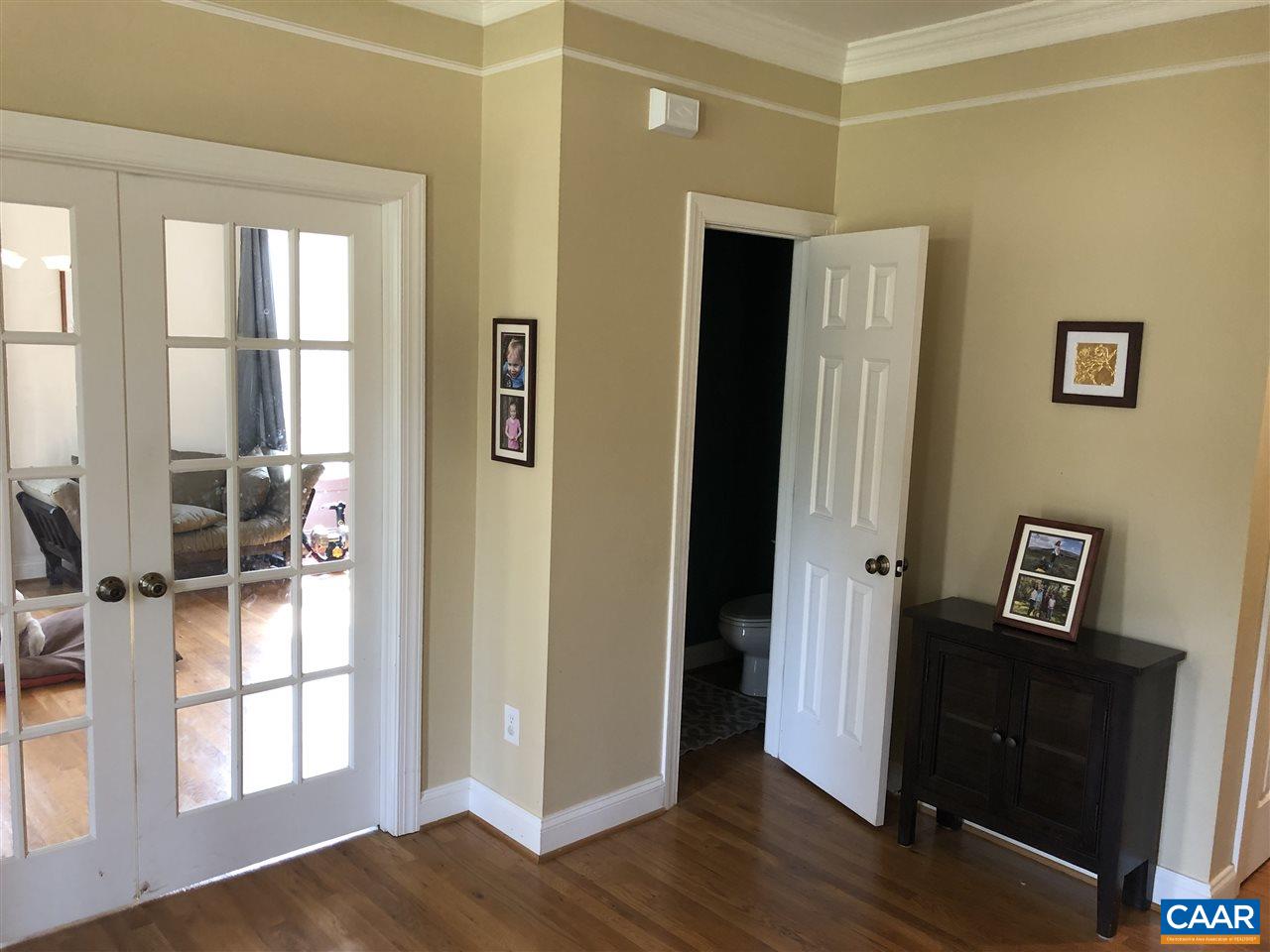 3285 Hardware River Road Charlottesville, VA 22903 - Photo 6 of 22 a view of a hallway with wooden floor and windows