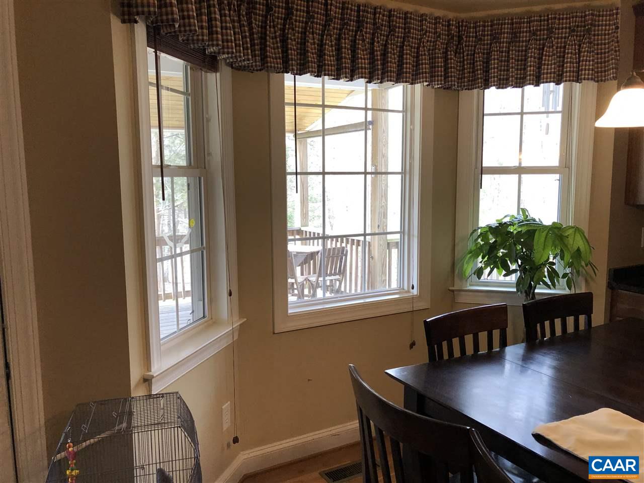 3285 Hardware River Road Charlottesville, VA 22903 - Photo 8 of 22 a view of a workspace with furniture and a window