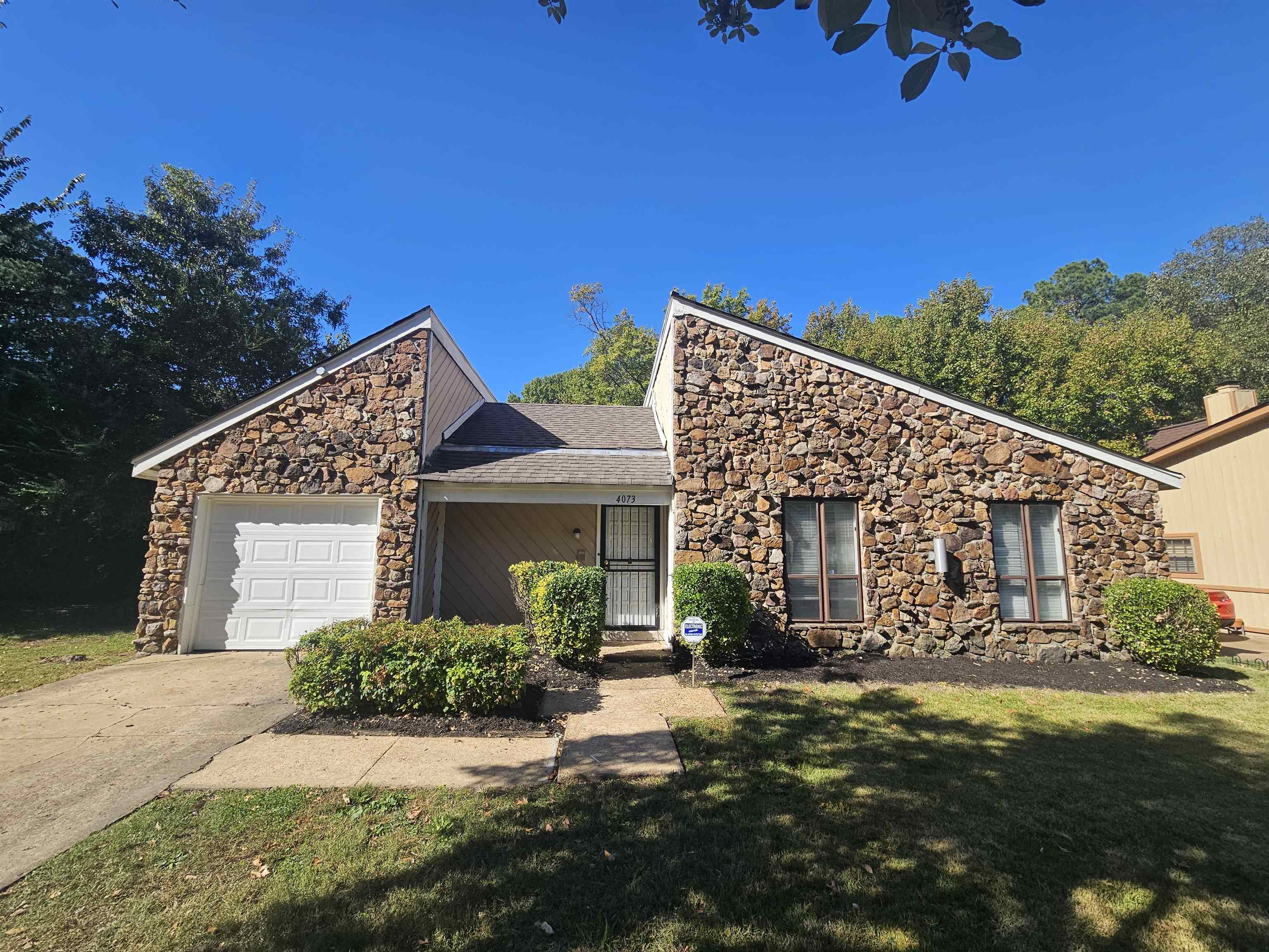 front view of a house with a street