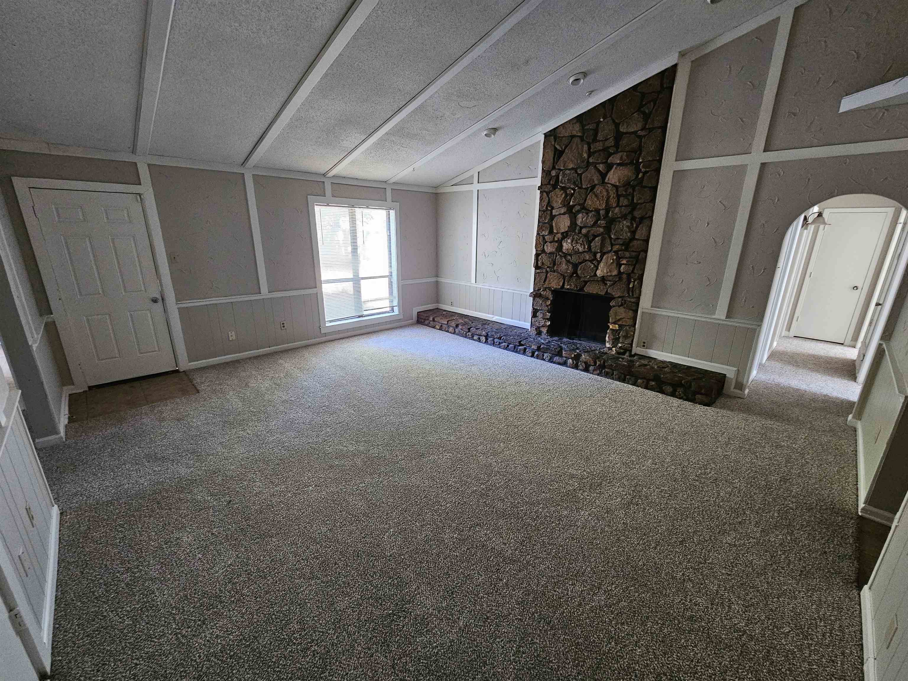 4073 Silverleaf Road Memphis, TN 38115 - Photo 3 of 17 a view of an empty room with a fireplace