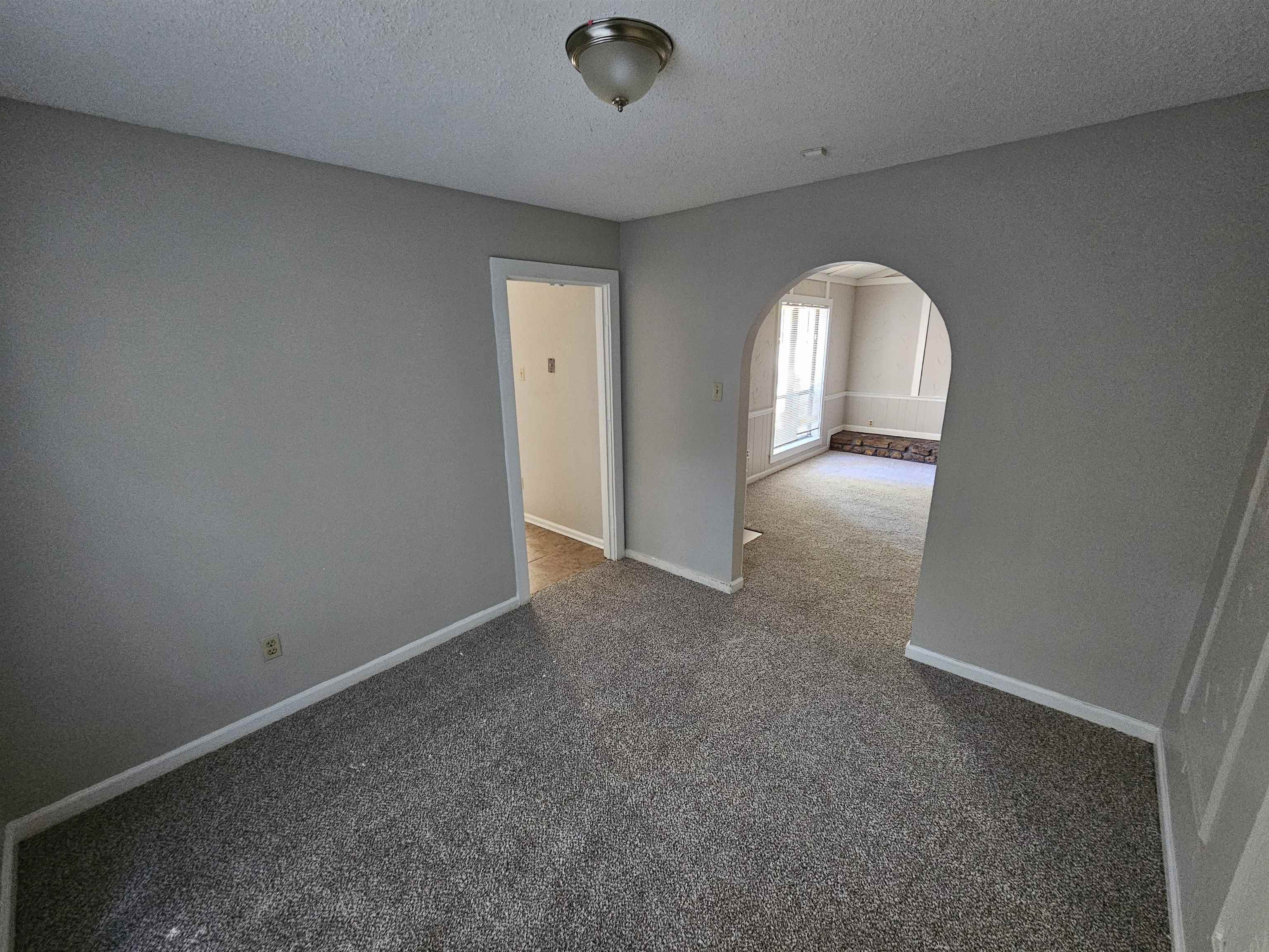 4073 Silverleaf Road Memphis, TN 38115 - Photo 5 of 17 an empty room with windows