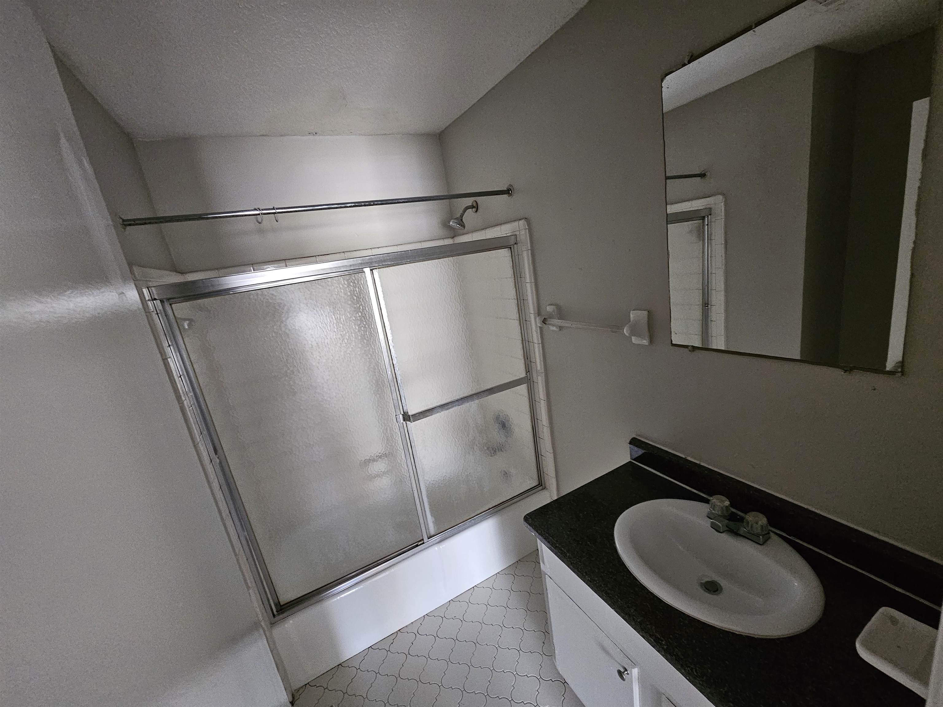 4073 Silverleaf Road Memphis, TN 38115 - Photo 8 of 17 a bathroom with a sink and a mirror