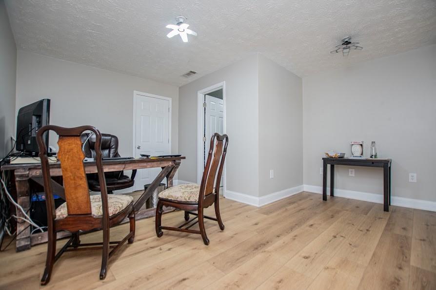 575 Liberty Church Road Carrollton, GA 30116 - Photo 56 of 95 a dining room with furniture and wooden floor