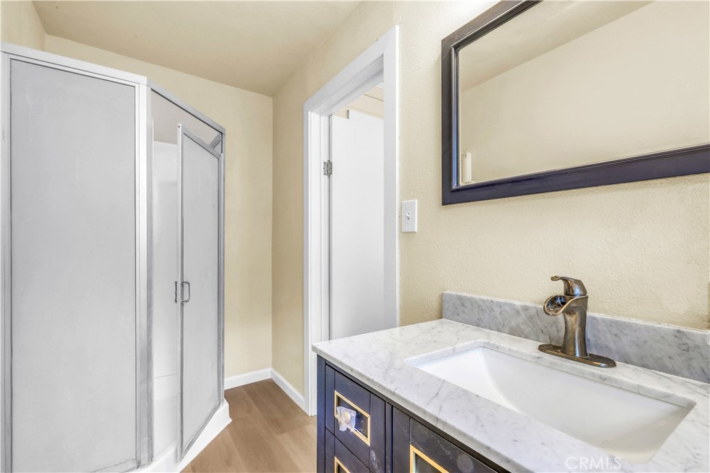 15905 Kugelman Street Lower Lake, CA 95457 - Photo 63 of 75 a bathroom with a sink and a mirror
