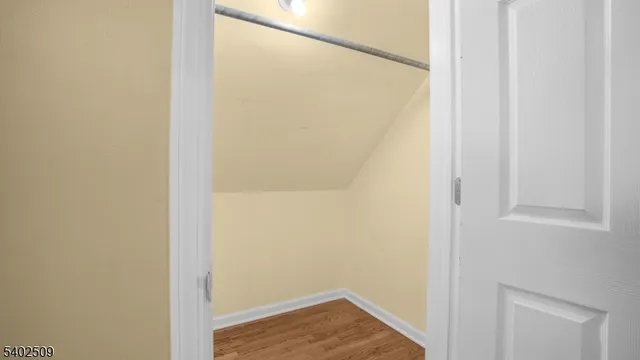 a view of a small space with wooden floor