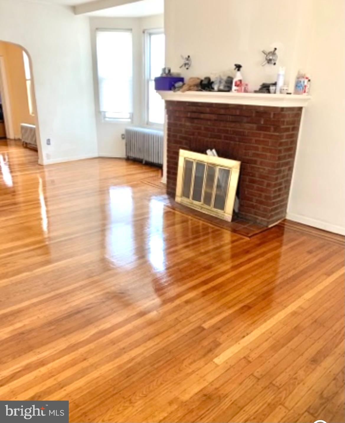 1101 Parker Street Chester, PA 19013 - Photo 3 of 15 a room with wooden floor and furniture