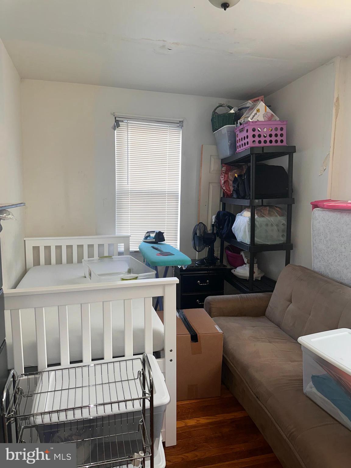 1101 Parker Street Chester, PA 19013 - Photo 10 of 15 a bedroom with a bed and a window