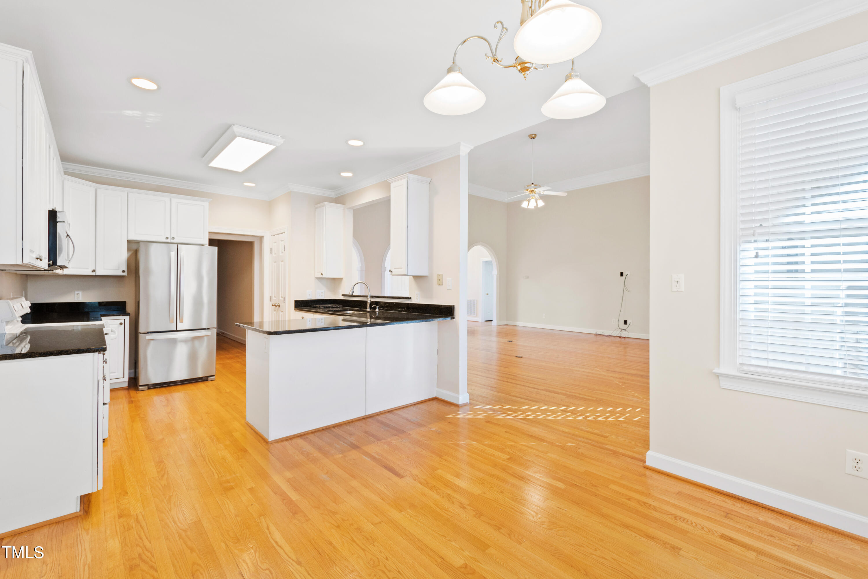 7637 Wilderness Road Raleigh, NC 27613 - Photo 13 of 33 a view of kitchen with wooden floor