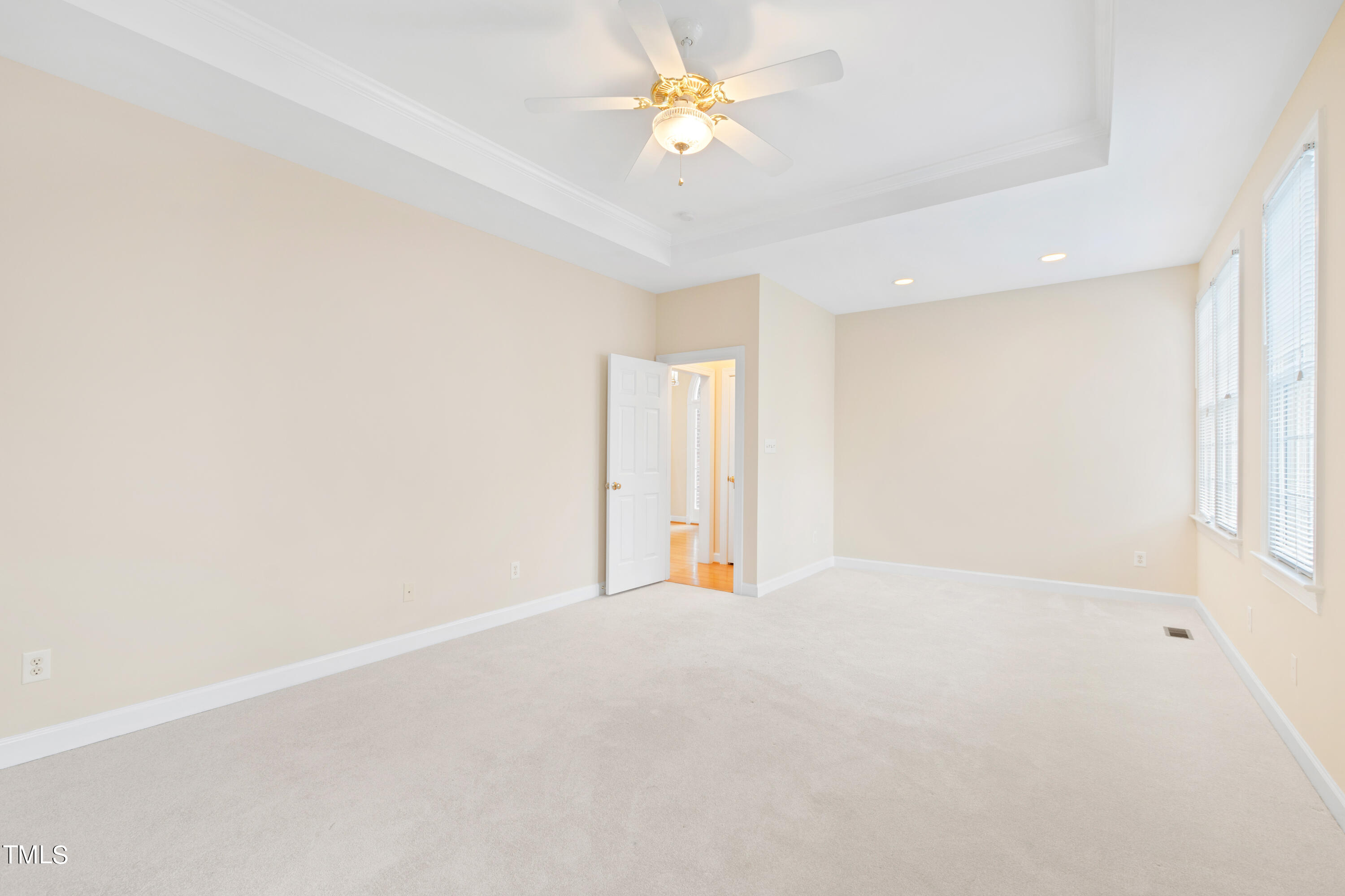 7637 Wilderness Road Raleigh, NC 27613 - Photo 17 of 33 a view of an empty room with a window