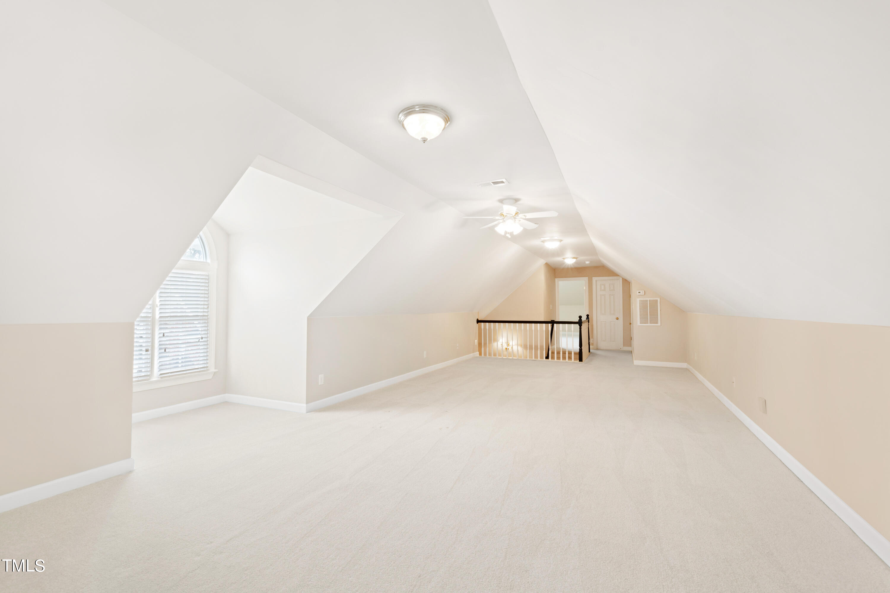 7637 Wilderness Road Raleigh, NC 27613 - Photo 26 of 33 an empty room with windows and pillars in it