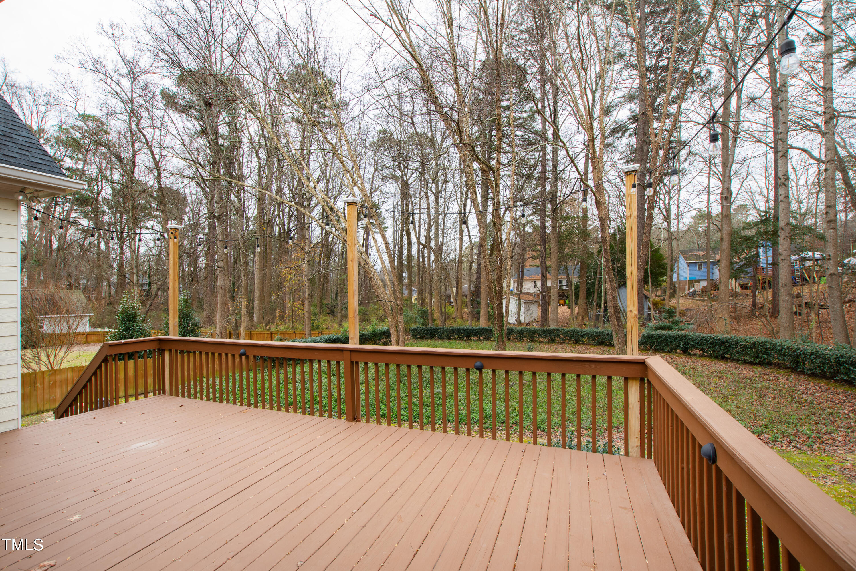7637 Wilderness Road Raleigh, NC 27613 - Photo 30 of 33 a view of balcony with wooden floor and outdoor seating
