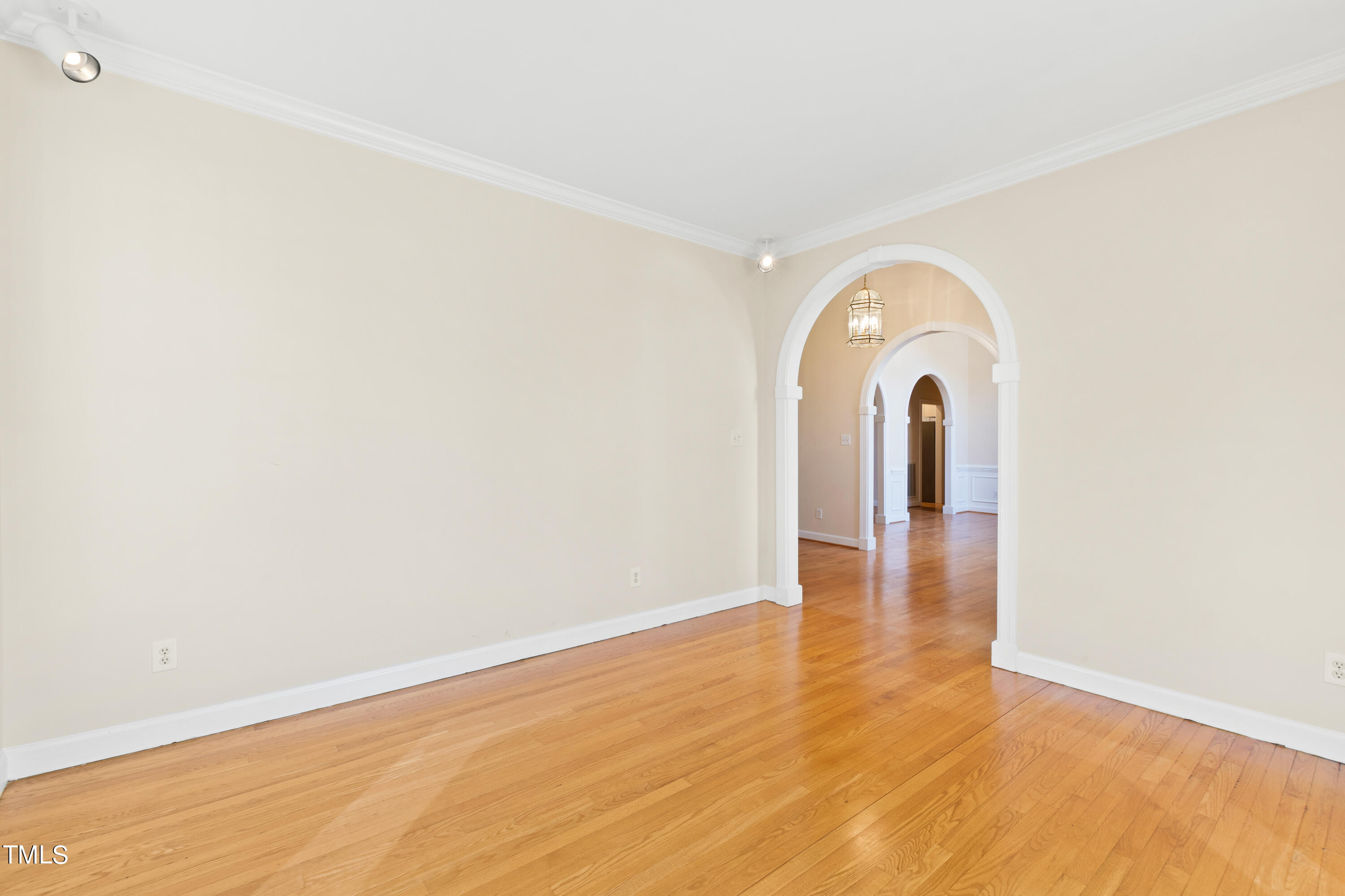 7637 Wilderness Road Raleigh, NC 27613 - Photo 7 of 33 a view of a room with wooden floor and a sink