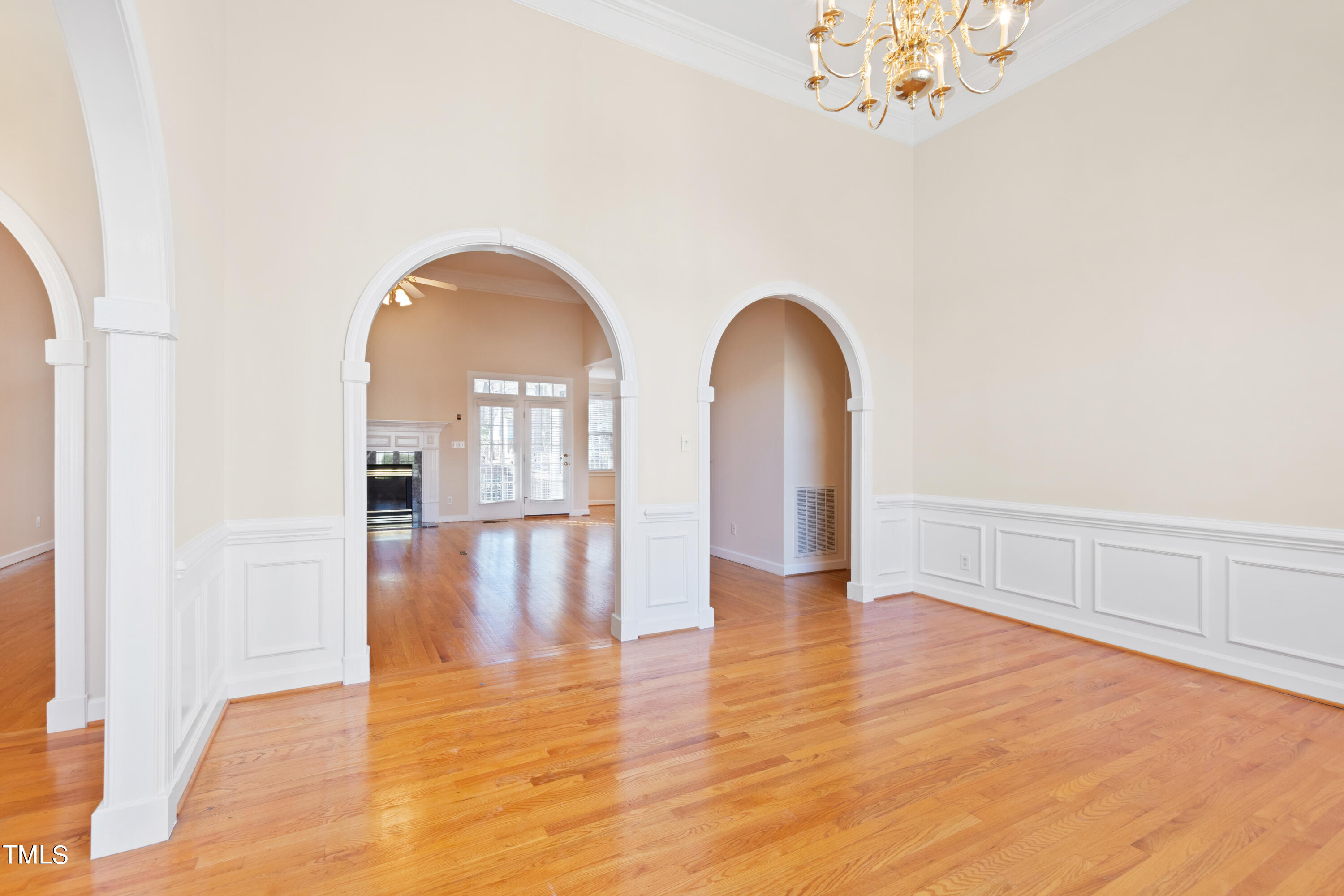 7637 Wilderness Road Raleigh, NC 27613 - Photo 9 of 33 a view of empty room with wooden floor