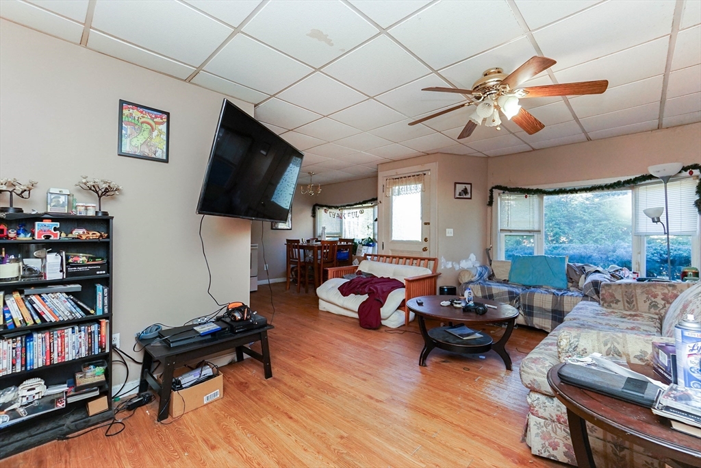 479 Main Street Hanson, MA 02341 - Photo 24 of 39 a living room with furniture and a flat screen tv