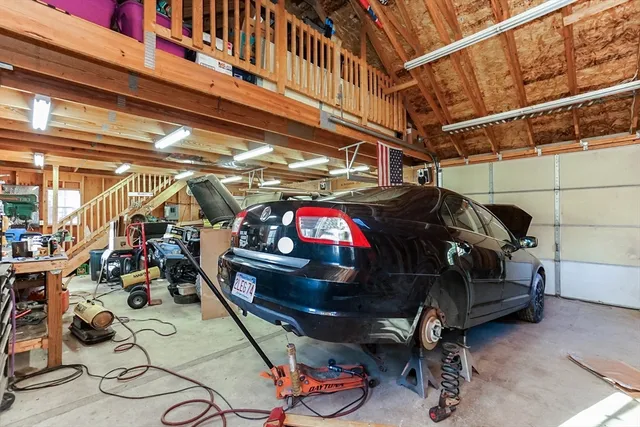 a view of a porch with furniture and a potted plant