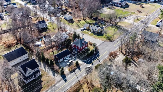 an aerial view of residential houses with outdoor space
