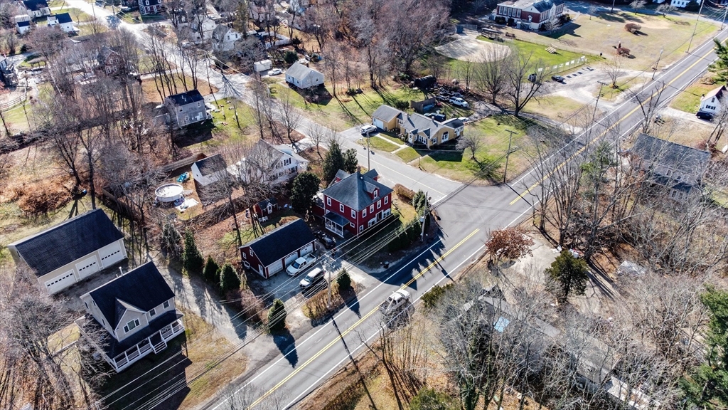 479 Main Street Hanson, MA 02341 - Photo 6 of 39 an aerial view of residential houses with outdoor space