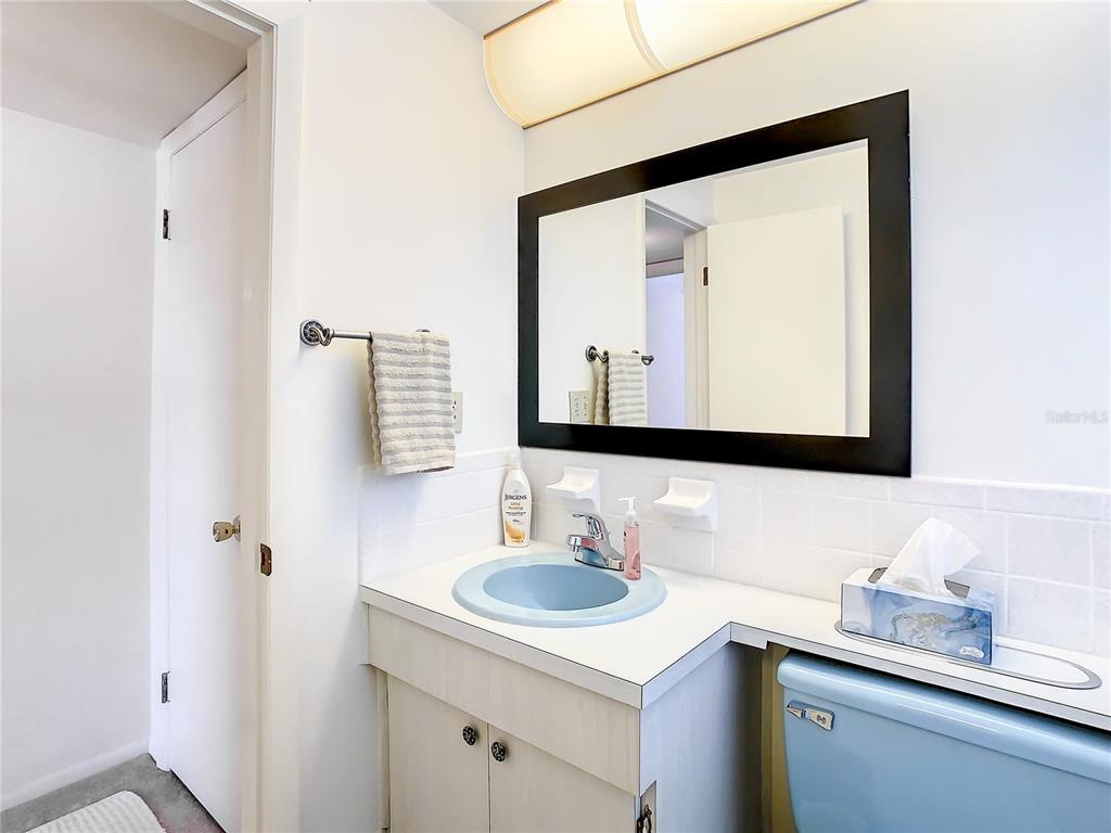 4230 Redcliff Place, Unit 4230 New Port Richey, FL 34652 - Photo 24 of 42 a bathroom with a sink vanity and a mirror