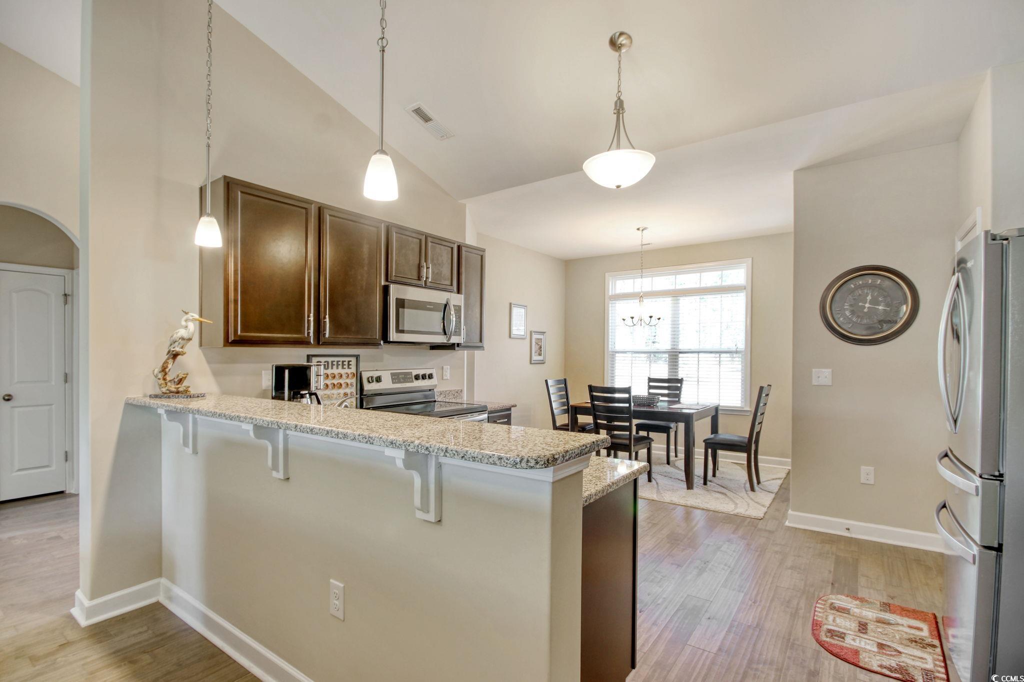 434 Carrick Loop Longs, SC 29568 - Photo 12 of 39 Kitchen featuring kitchen peninsula, hanging light
