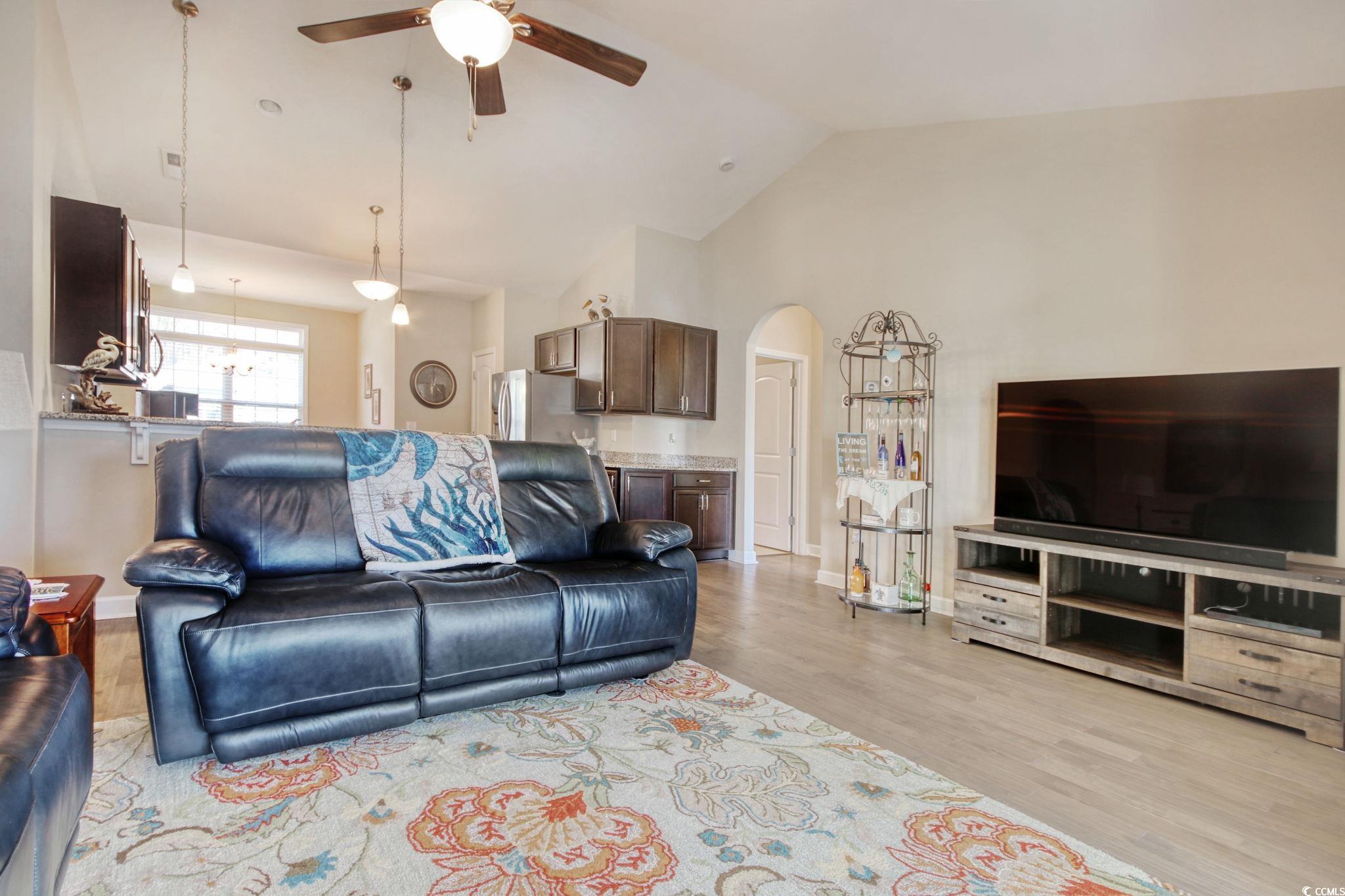 434 Carrick Loop Longs, SC 29568 - Photo 15 of 39 Living room featuring lofted ceiling, ceiling fan,
