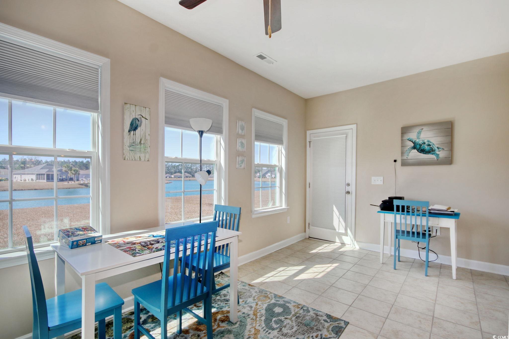 434 Carrick Loop Longs, SC 29568 - Photo 17 of 39 Tiled dining space featuring a water view and ceil