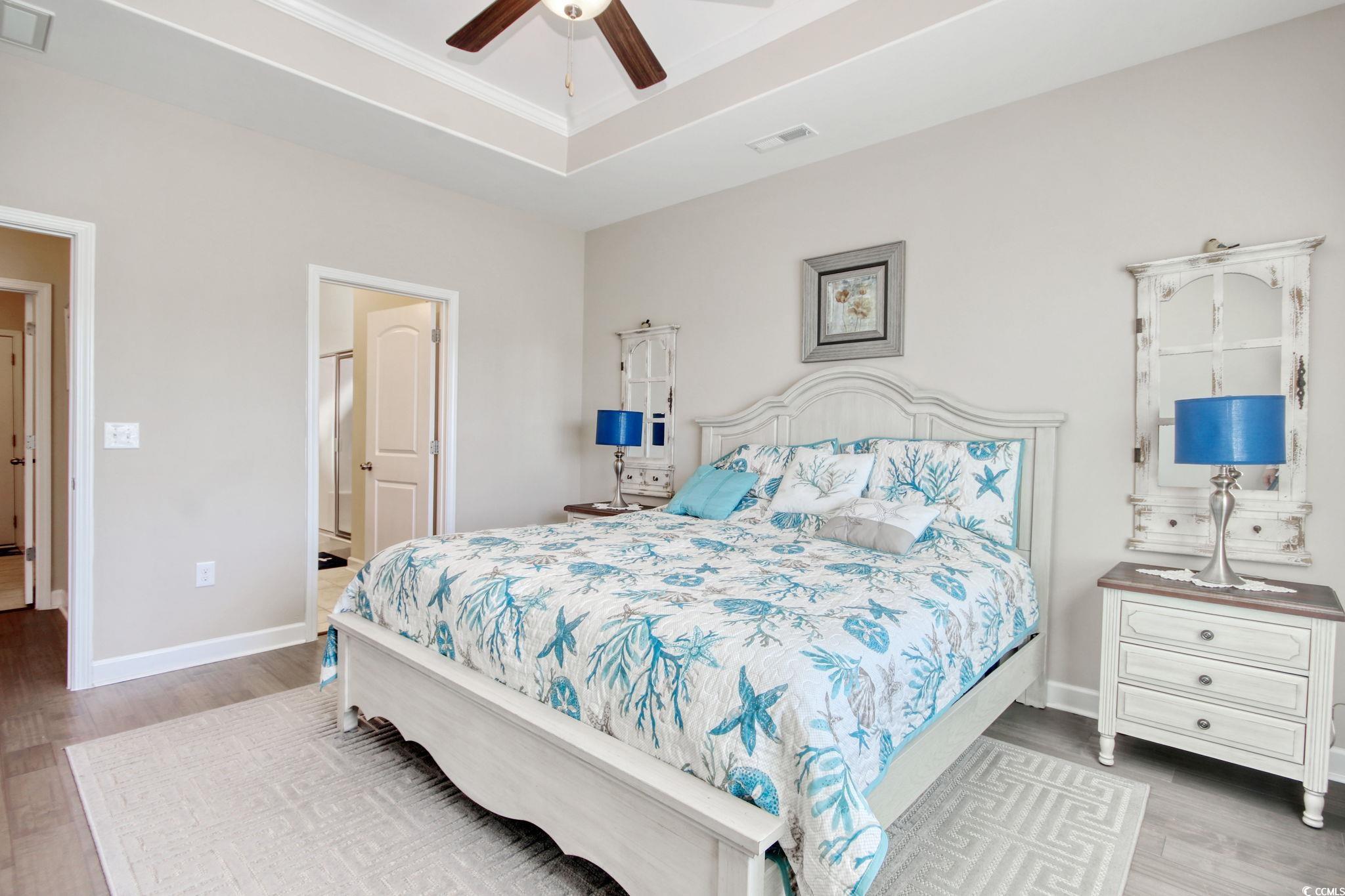 434 Carrick Loop Longs, SC 29568 - Photo 21 of 39 Bedroom featuring light wood-type flooring, a tray