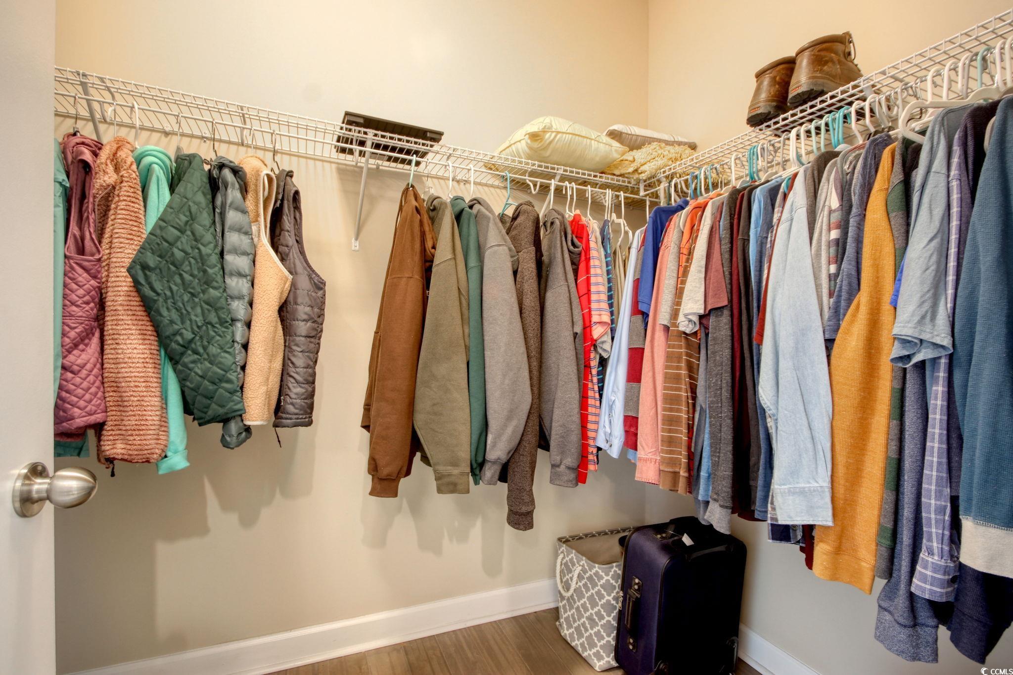 434 Carrick Loop Longs, SC 29568 - Photo 23 of 39 Walk in closet featuring wood-type flooring