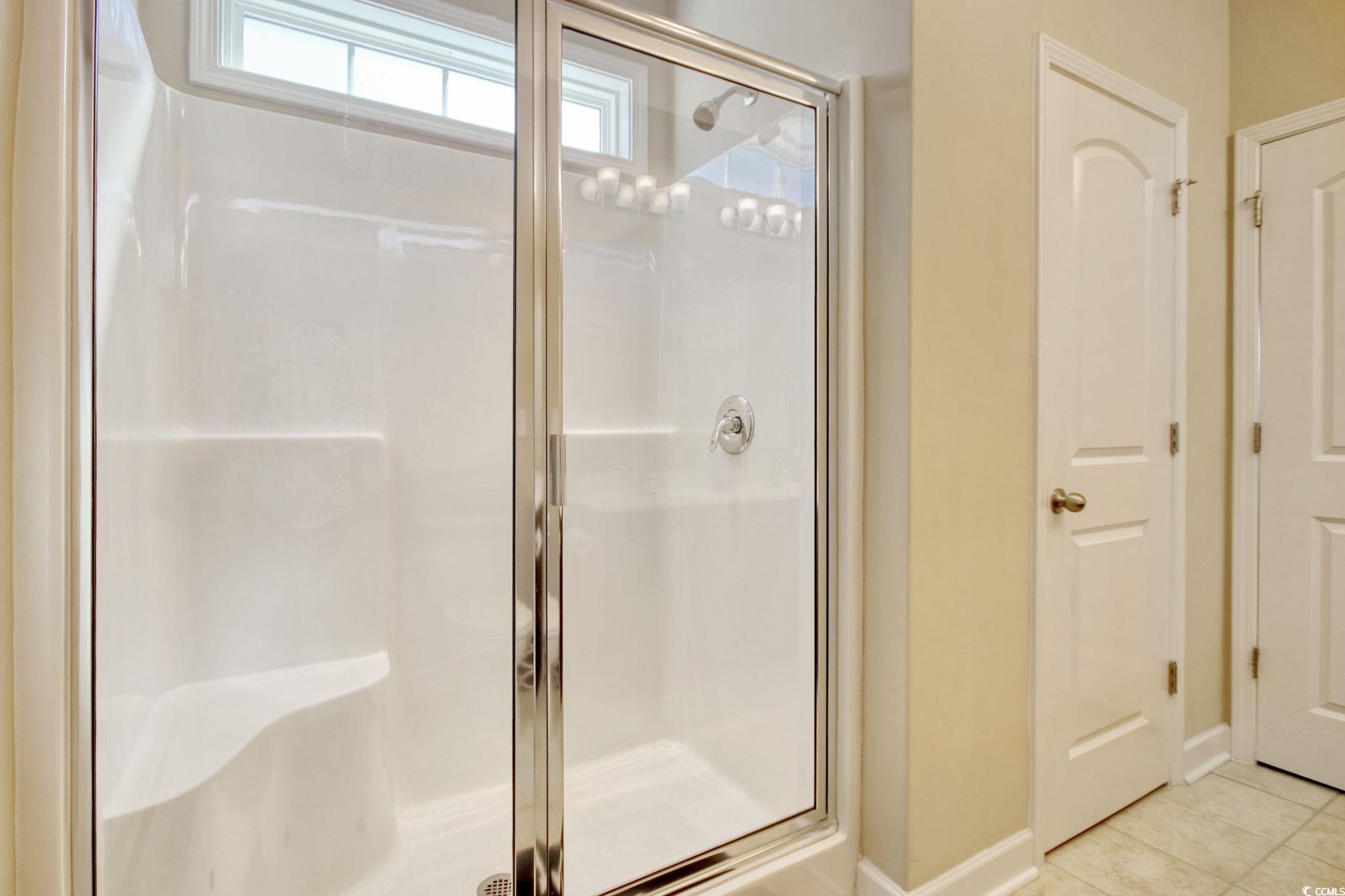434 Carrick Loop Longs, SC 29568 - Photo 24 of 39 Bathroom with tile patterned flooring and a shower