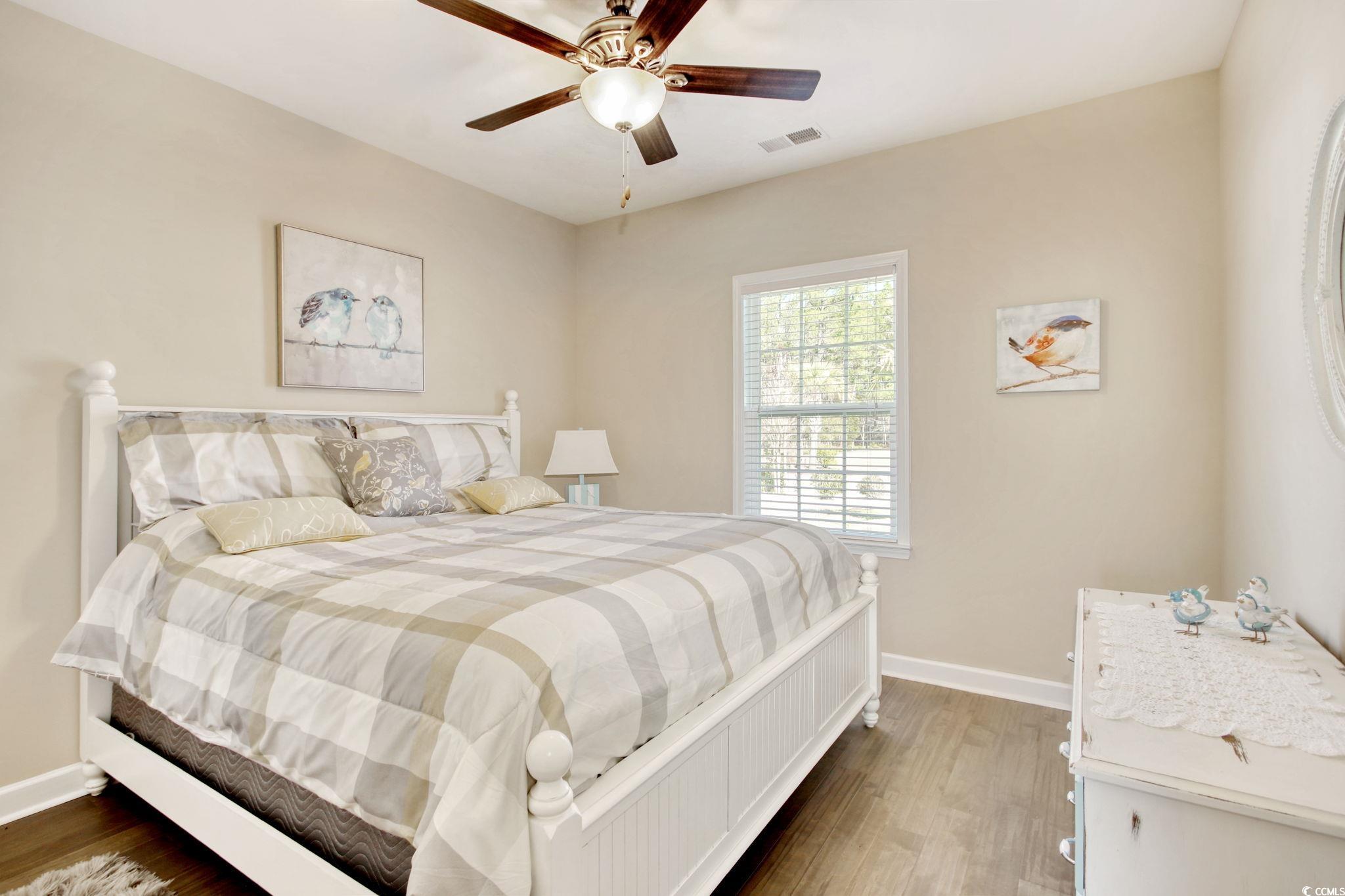 434 Carrick Loop Longs, SC 29568 - Photo 25 of 39 Bedroom with dark wood-type flooring and ceiling f