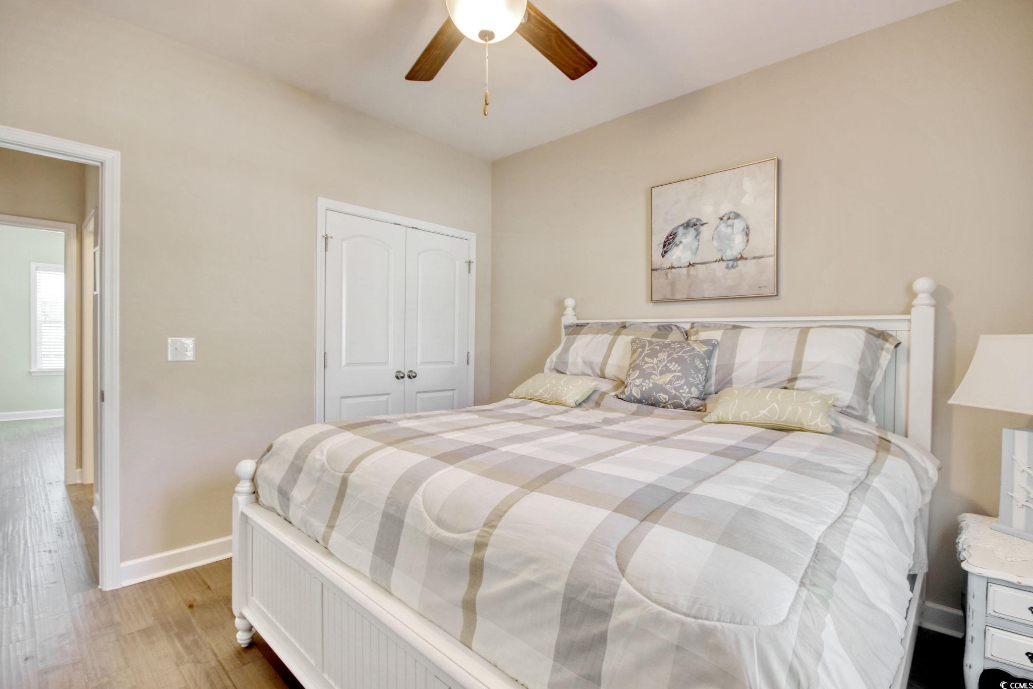 434 Carrick Loop Longs, SC 29568 - Photo 26 of 39 Bedroom featuring ceiling fan, a closet, and light