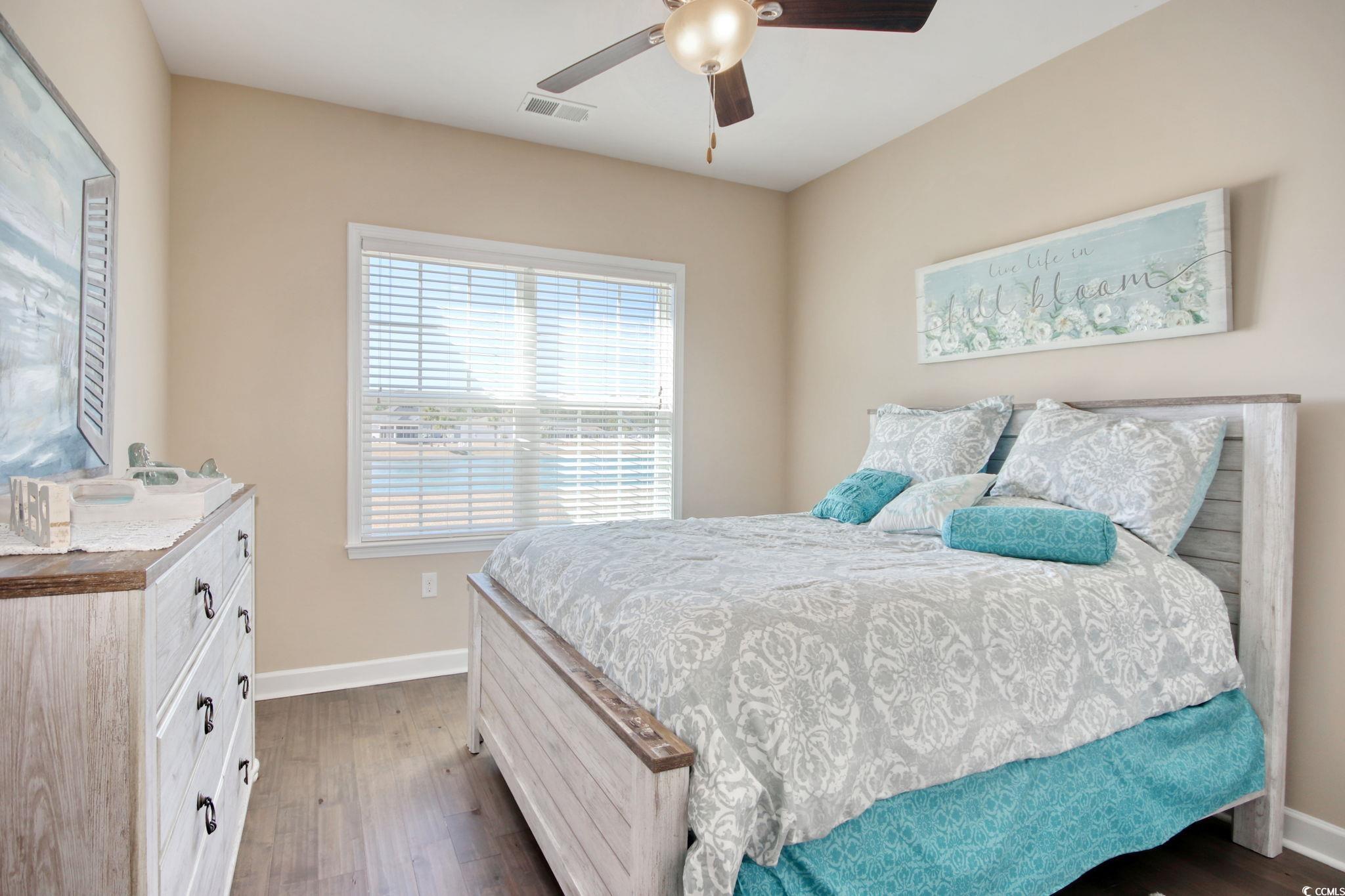 434 Carrick Loop Longs, SC 29568 - Photo 28 of 39 Bedroom with dark wood-type flooring and ceiling f