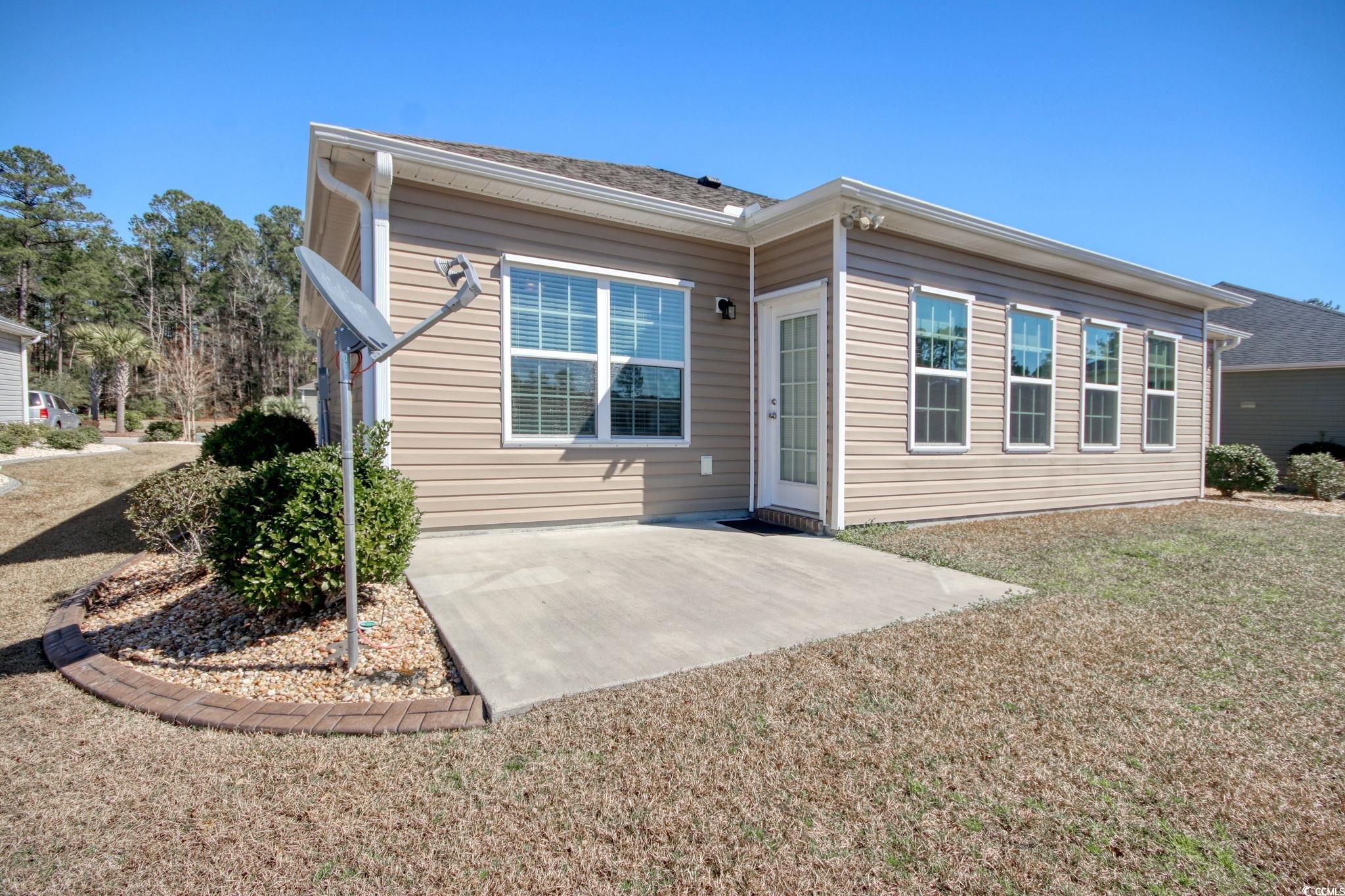 434 Carrick Loop Longs, SC 29568 - Photo 32 of 39 Back of property with a patio and a yard