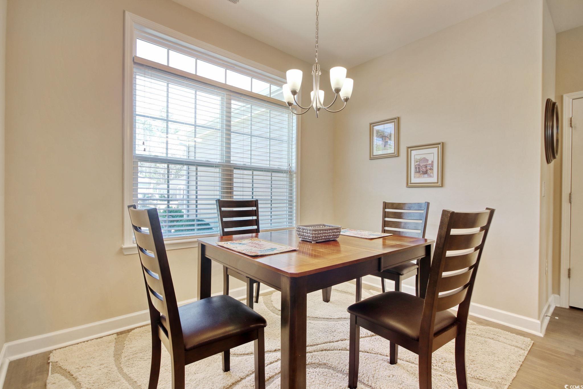 Dining space featuring light hardwood / wood-style