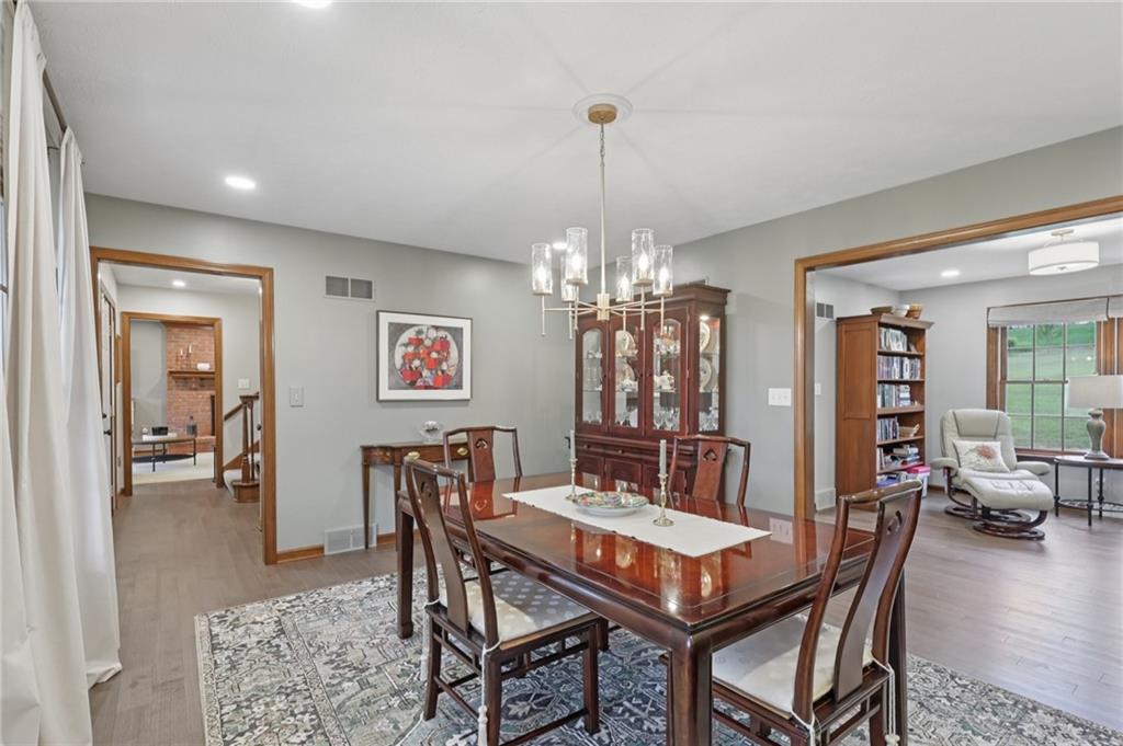 111 American School Road Harmony, PA 16037 - Photo 15 of 46 a view of a dining room with furniture wooden floor and chandelier