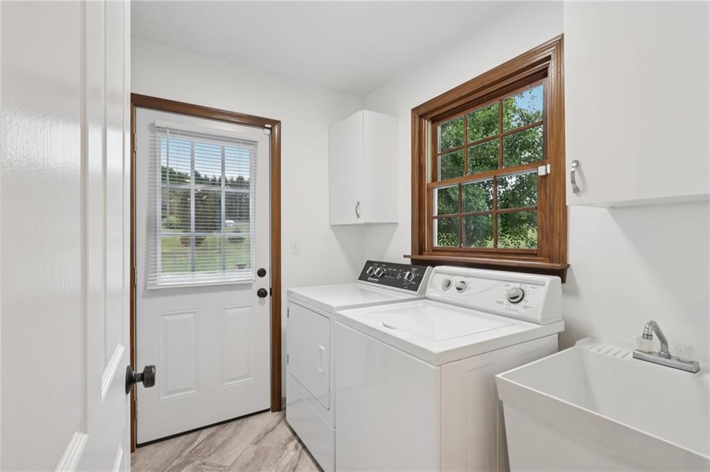 111 American School Road Harmony, PA 16037 - Photo 18 of 46 a utility room with dryer and washer