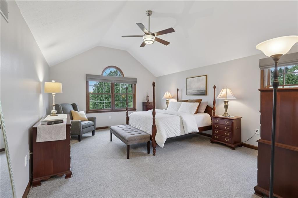111 American School Road Harmony, PA 16037 - Photo 20 of 46 a bed room with a bed and a chandelier