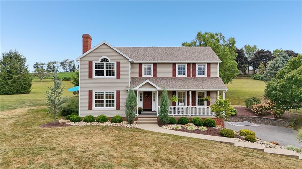 111 American School Road Harmony, PA 16037 - Photo 2 of 46 a front view of a house with a yard and garage