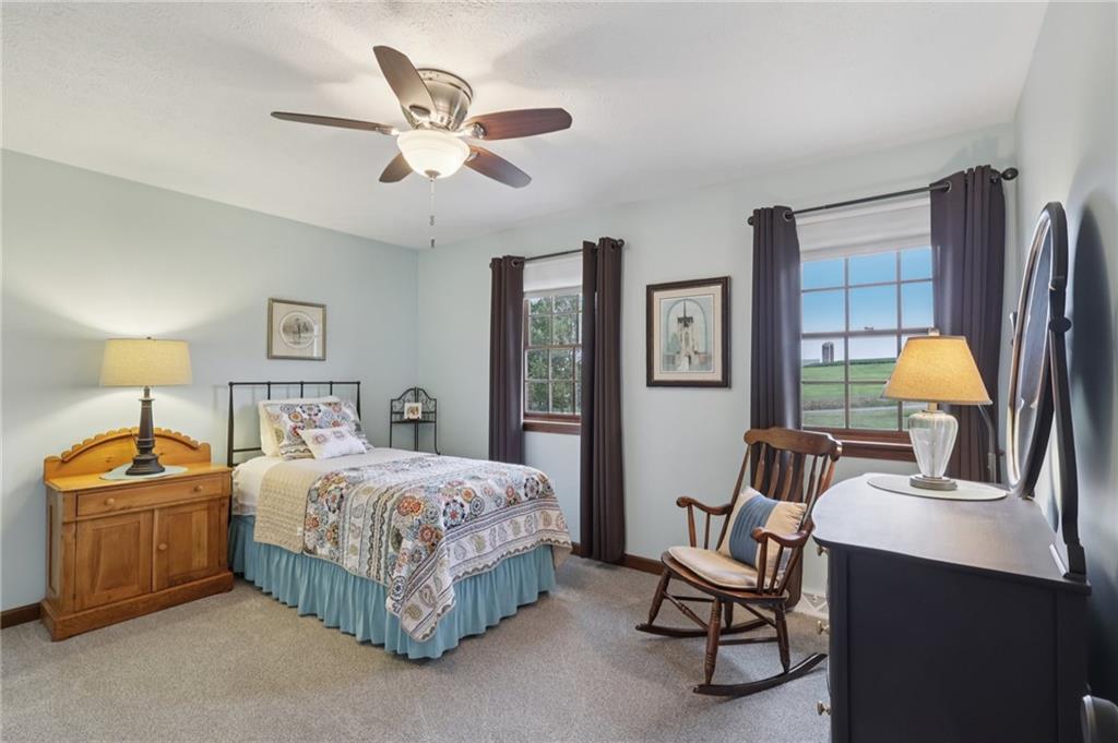 111 American School Road Harmony, PA 16037 - Photo 25 of 46 a bedroom with a bed a desk and chair
