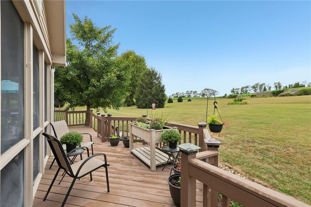 111 American School Road Harmony, PA 16037 - Photo 30 of 46 a view of a balcony with wooden chairs and a table