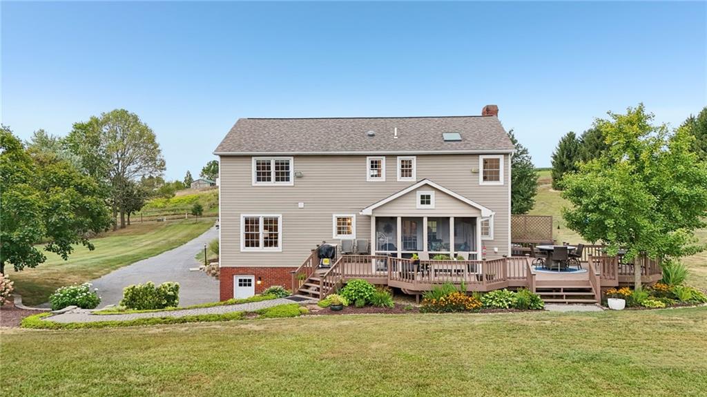 111 American School Road Harmony, PA 16037 - Photo 34 of 46 a front view of a house with a yard table and chairs