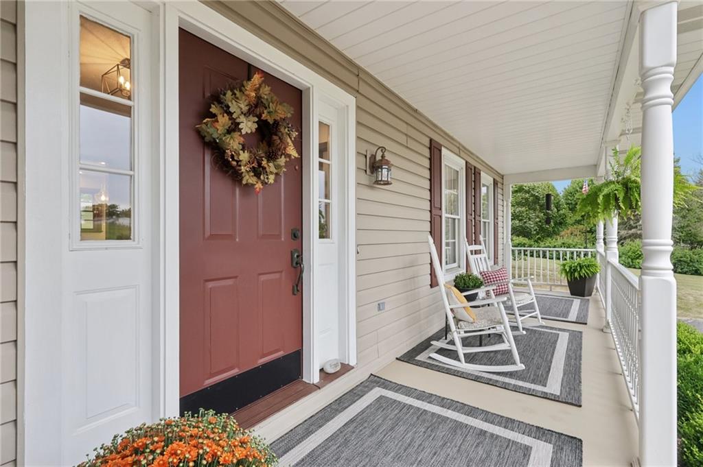 111 American School Road Harmony, PA 16037 - Photo 5 of 46 a view of front door and porch with wooden floor