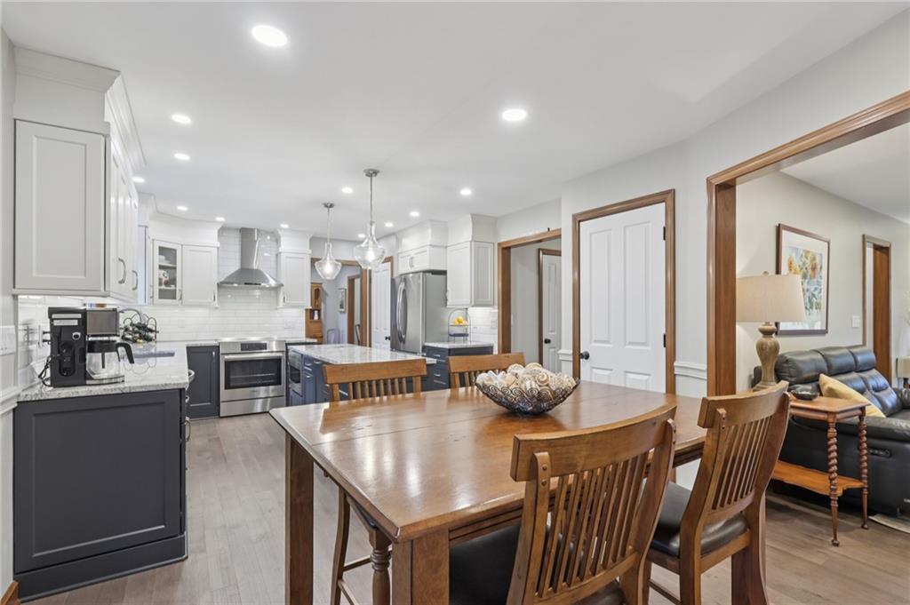111 American School Road Harmony, PA 16037 - Photo 10 of 46 a kitchen with stainless steel appliances kitchen island granite countertop a sink and cabinets